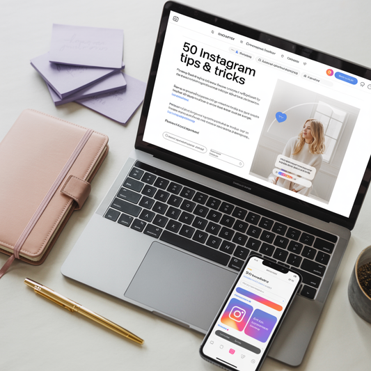 Laptop displaying an Instagram tips and tricks article on a desk with a phone and notebook.